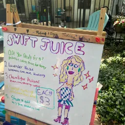 A board with "swift juice" and multiple options from Taylor Swift songs